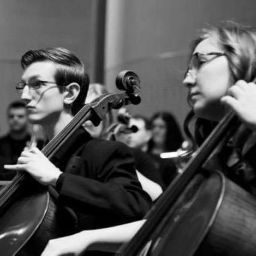 Thomas and Kassidy playing the cello on stage